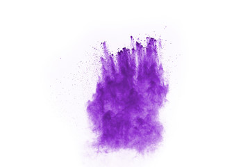 Powder explosion. Closeup of a purple dust particle explosion isolated on white. Abstract background.