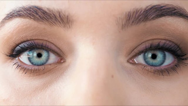 Beautiful close-up footage of female eyes with classic eyeliner make-up