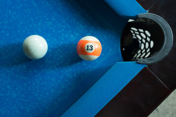 Sport billiard balls on blue billiard table