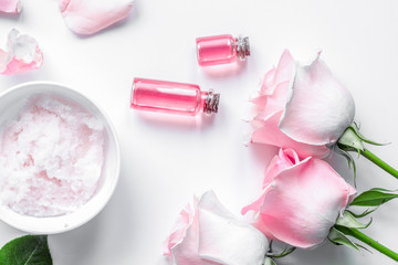 organic cosmetic with rose oil on white background top view