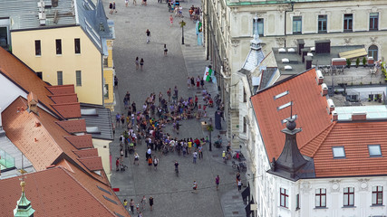 Fototapeta premium Crowd of tourists watching street performance, high risk pickpocket area in city