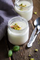 Obraz na płótnie Canvas Natural yogurt in a glass jar