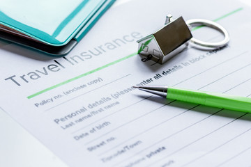 Traveling concept with insurance application on white table