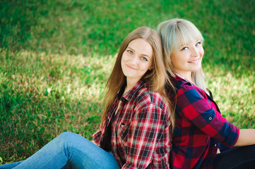 Fototapeta premium Two friends smiling outside