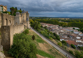Fototapeta na wymiar Carcassonne castle, surrounding town and countryside in the evening sunlight.