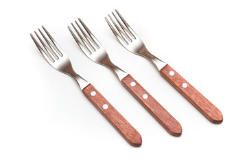 Set of three forks with wooden handles on white background