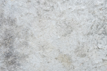 Gray grange wall texture for background with some patches and cracks.