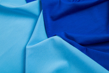 folds of blue triangular tissue as background abstraction