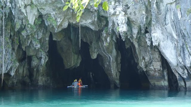 Tourists going inside Underground river by boat, Sabang, Philippines