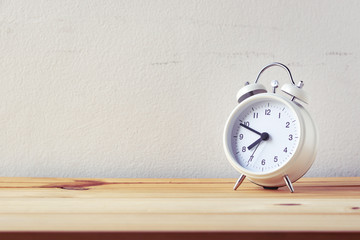 retro alarm clock on wood table