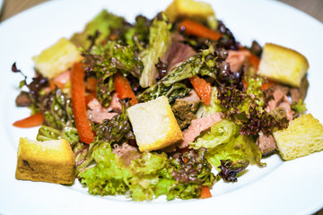 Healthy salads made of hot beef and fresh