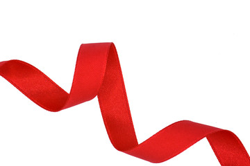 spiral of red fabric ribbon isolated on white background