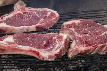 grilling steak on the barbecue