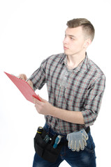 Young engineer. An attractive guy. White background. 