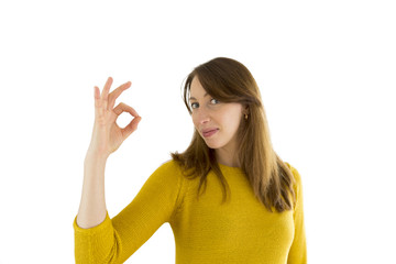 Fototapeta premium portrait of pretty smiling woman showing ok sign isolated on white background