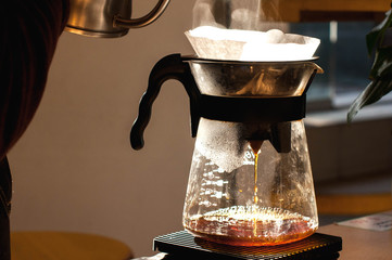 barista making alternative way of brewing coffee in the coffee shop hario v60 soft light