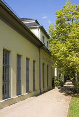 Fototapeta na wymiar Altenburg / Germany: View along the facade of the baroque orangery in the public castle garden