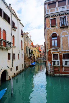Venice, Veneto / Italy - March 2018: Colorful buildings line the waterway in Venice, Italy.