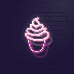 Neon muffin. Night illuminated wall street sign. Isolated geometric style illustration on brick wall background.