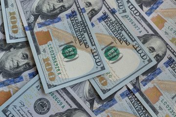Dollars banknotes as a background. American dollars money. Hundred dollars bill. Texture of one...