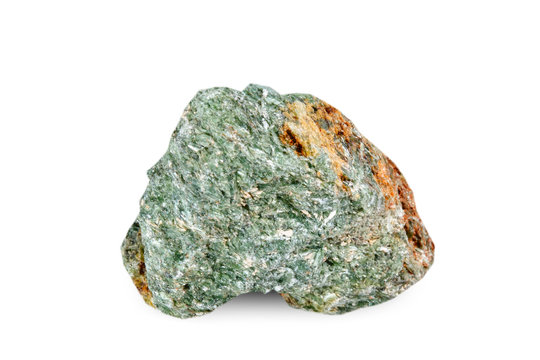 Macro shooting of natural gemstone. The raw mineral is diopside, Brazil. Isolated object on a white background.