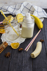 milk shake in a jar on a wooden background