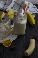 milk shake in a jar on a wooden background