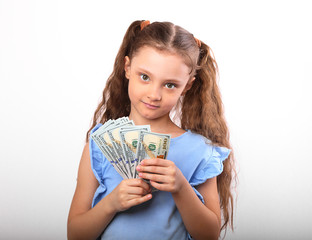 Happy smiling rich kid girl holding money two hands on white background with empty copy space