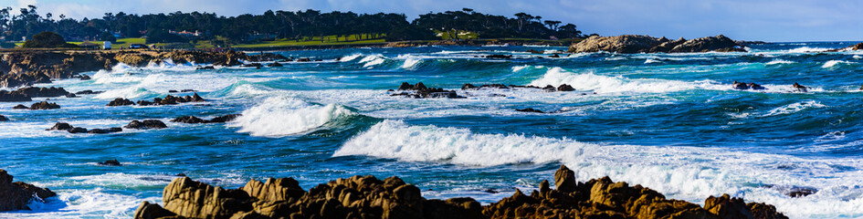 Surf Rocks -Pebble Beach, California, February 18, 2018:  Wave action on the rocks at Pebble Beach...