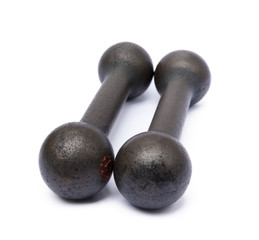 Old fitness dumbbells isolated on a white background