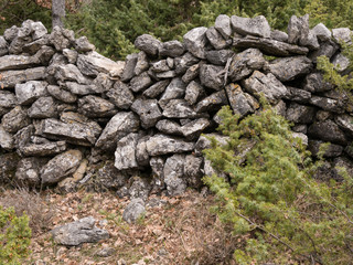 An old stone wall in the forest in Croatia