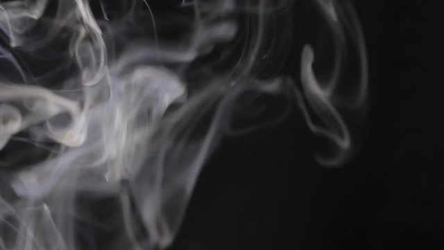 Swirling Smoke on Black Background Close-Up Macro Detail