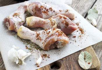 Raw chicken legs with spices
