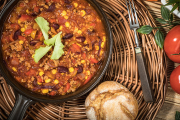 Chili con carne in a clay pan.