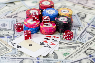 Dollars, Cards of Four Ace, Poker Chip and Dice