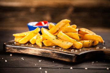 French fries on wooden table