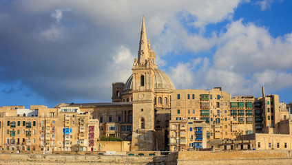 Fototapeta premium Valletta, Malta, Skyline in the afternoon with the dome of the Carmelite Church and the tower of St Paul`s