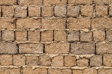 Weathered stained old brick wall background. close-up