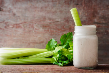 smoothies with oat flakes and celery in glass