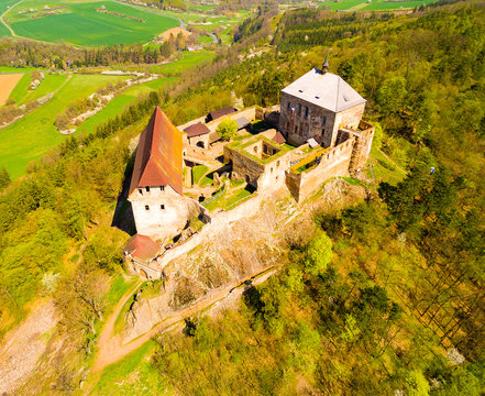 Aerial view of Tocnik Castle. A royal chateau of Wenceslas IV from the 14th century, adjusted in the Renaissance and the Baroque styles. Famous Czech monument from above.