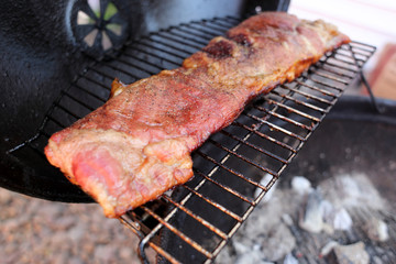 Dry rub pork ribs on the BBQ grill.