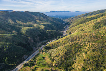 Obraz premium Narrow road leads through the canyon country of southern California.