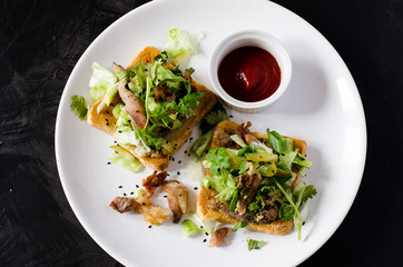 Toasts with grilled pork, vegetable, cilantro and Sriracha sauce