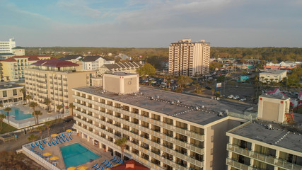 Fototapeta premium Aerial view of Myrtle Beach skyline and ocean at sunset, South Carolina