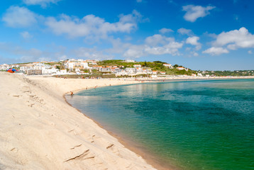 Fototapeta na wymiar Rest on the sand beach. Summer photo near sea. Beach on Foz do Arelho, Portugal.