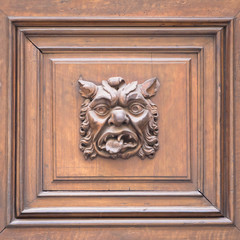 Italy - Mask on an old door