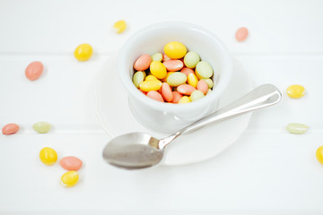 Colorful dragee sprinkles. Peanuts coated with sweet yoghurt.