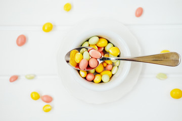 Colorful dragee sprinkles. Peanuts coated with sweet yoghurt.