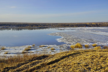 ice drift on the river. large ice floes floating on the water. spring is melting ice cracking. top view of the river