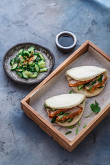 Bao buns with cucumber salad, close view
